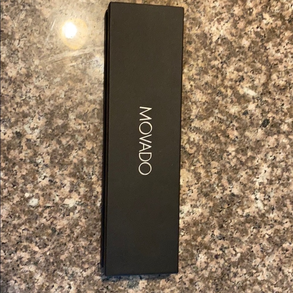 Movado watch with box and tags.